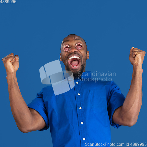 Image of African man\'s portrait isolated on studio background, monochrome