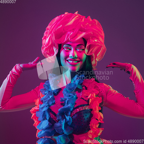 Image of Caucasian woman\'s portrait isolated on studio background in neon light