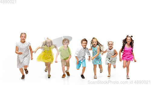Image of Happy little caucasian kids jumping and running isolated on white background