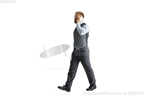 Image of Cheerful handsome businessman isolated over white studio background