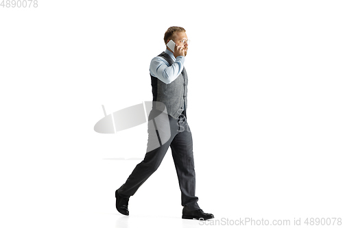 Image of Cheerful handsome businessman isolated over white studio background