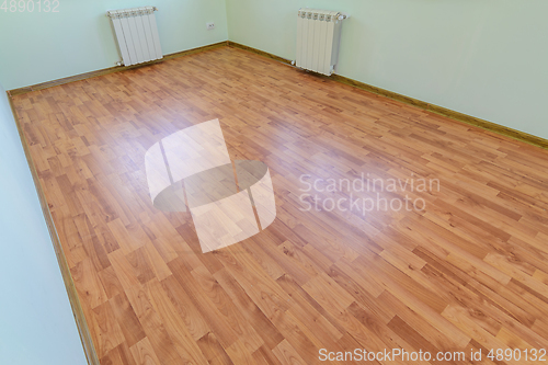 Image of Laminate on the floor of the room after renovation in the apartment