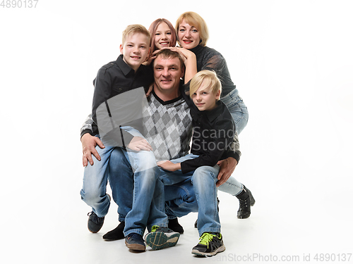 Image of Children and mom hug happy dad, isolated on white background