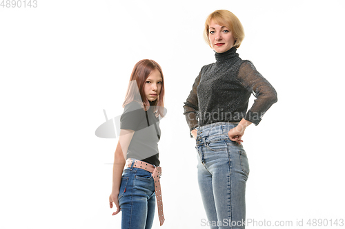 Image of Upset girl and smiling girl look into the frame, isolated on white background