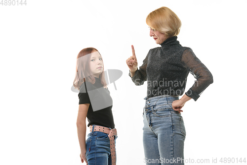Image of Woman punishing daughter for wrongdoing, isolated on white background