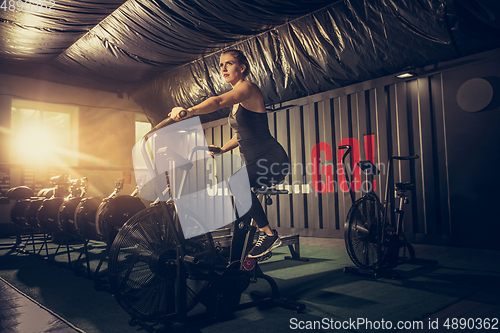 Image of The female athlete training hard in the gym. Fitness and healthy life concept.