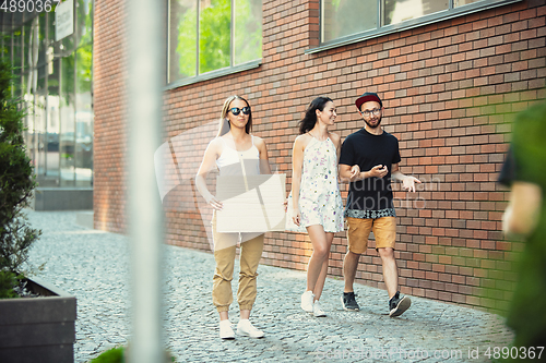 Image of Dude with sign - woman stands protesting things that annoy her