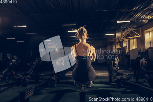 Image of The female athlete training hard in the gym. Fitness and healthy life concept.