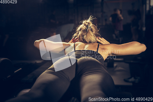 Image of The female athlete training hard in the gym. Fitness and healthy life concept.