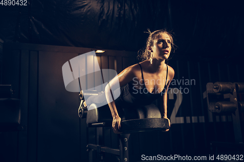 Image of The female athlete training hard in the gym. Fitness and healthy life concept.