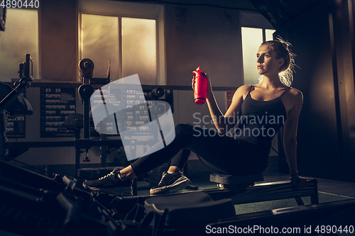 Image of The female athlete training hard in the gym. Fitness and healthy life concept.