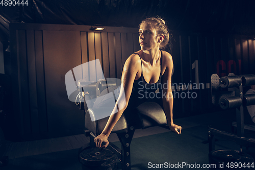 Image of The female athlete training hard in the gym. Fitness and healthy life concept.
