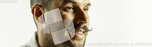 Image of Caucasian young man\'s close up cropped shot on studio background, flyer