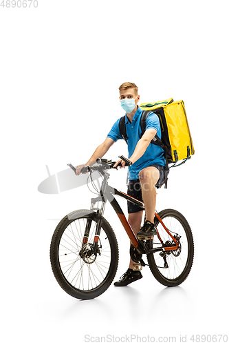 Image of Deliveryman isolated on white studio background. Contacless delivery service during quarantine.