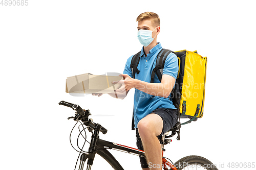 Image of Deliveryman isolated on white studio background. Contacless delivery service during quarantine.