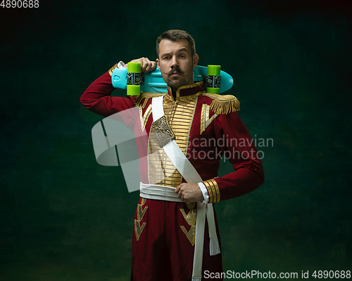 Image of Young man as Nicholas II on dark green background. Retro style, comparison of eras concept.