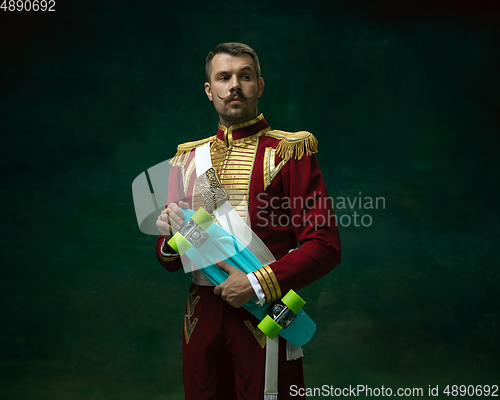 Image of Young man as Nicholas II on dark green background. Retro style, comparison of eras concept.