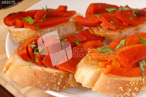 Image of Roasted red pepper and basil bruschetta on a white plate