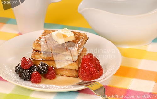 Image of Waffles with fruit and powdered sugar