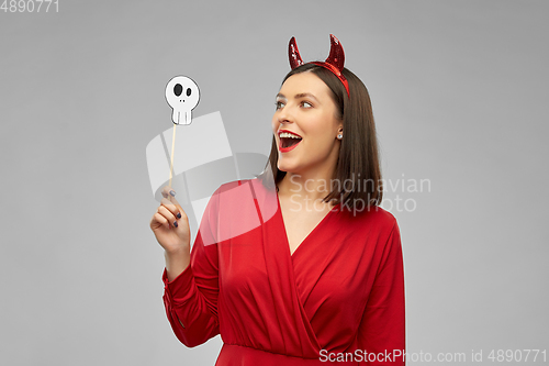 Image of happy woman in red halloween costume of devil