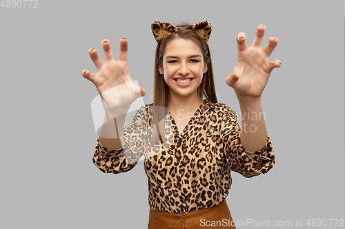 Image of happy woman in halloween costume of leopard