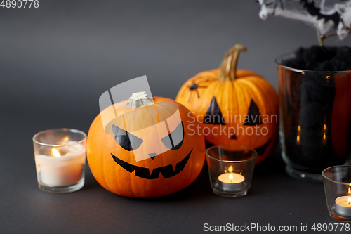 Image of pumpkins, candles and halloween decorations