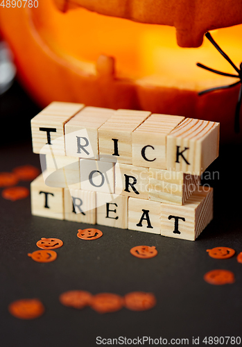 Image of toy blocks with trick or treat words on halloween