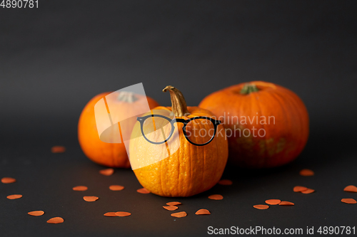Image of halloween pumpkins with glasses