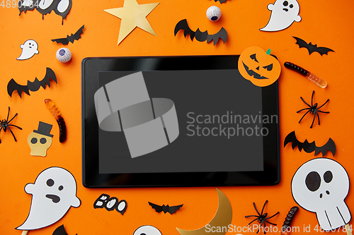 Image of tablet pc, halloween party props and decorations