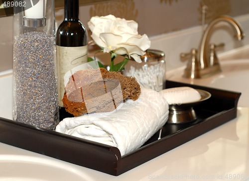 Image of Towels, soap, sponges and bathoil on vanity