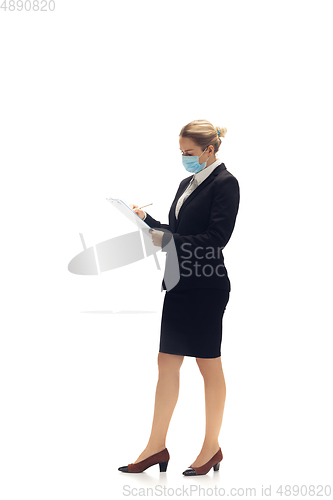 Image of Young woman, accountant, booker in office suit isolated on white studio background