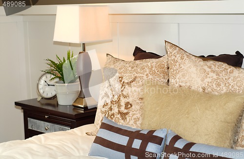 Image of Bedroom scene with bed and nightstand