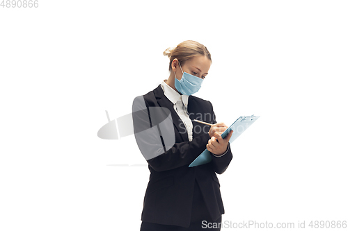 Image of Young woman, accountant, booker in office suit isolated on white studio background