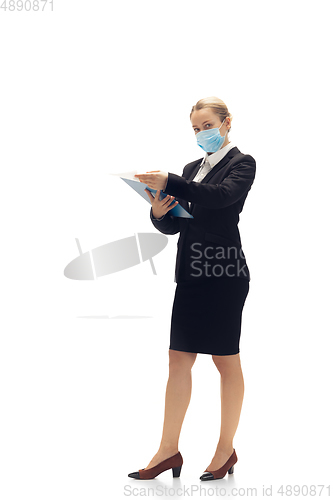 Image of Young woman, accountant, booker in office suit isolated on white studio background