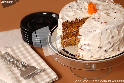 Image of Whole carrot cake with cream cheese and pecan frosting