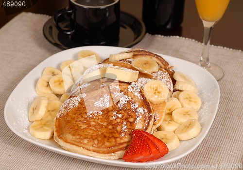 Image of Banana pancakes with coffe and orange juice