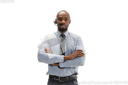 Image of Young african-american call center consultant with headset isolated on white studio background