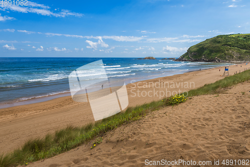 Image of View to the Zarautz Beach with walking people, Basque Country, Spain on a beautiful summer day