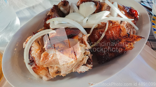 Image of A juicy fresh pork roast sliced on a plate