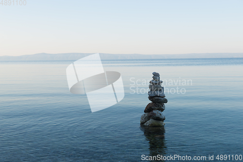 Image of Balance stone pyramid on the sea coast