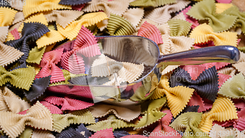 Image of Colored Farfalle Pasta bow tie pasta background.