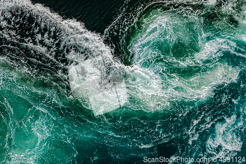 Image of Waves of water of the river and the sea meet each
