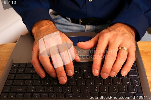 Image of Male Hands Working on Laptop