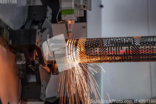 Image of CNC Laser cutting of metal, modern industrial technology.