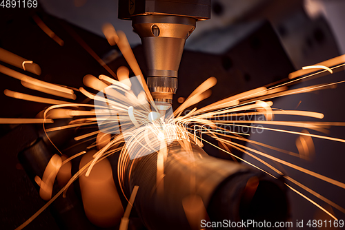 Image of CNC Laser cutting of metal, modern industrial technology.