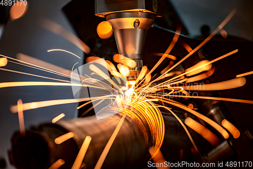 Image of CNC Laser cutting of metal, modern industrial technology.