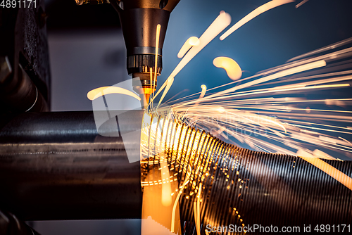 Image of CNC Laser cutting of metal, modern industrial technology.