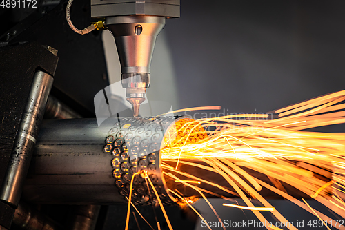 Image of CNC Laser cutting of metal, modern industrial technology.