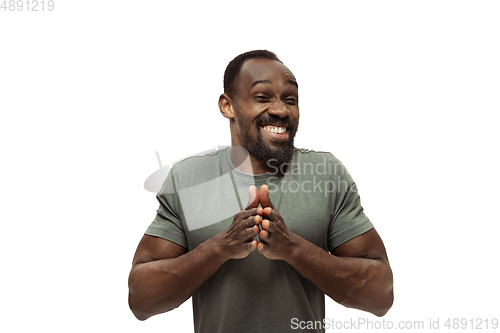 Image of Young african-american man with funny, unusual popular emotions and gestures isolated on white studio background