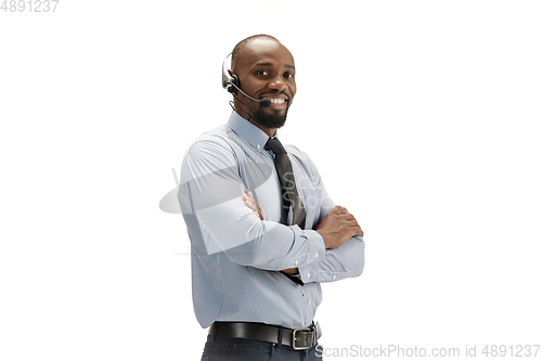 Image of Young african-american call center consultant with headset isolated on white studio background